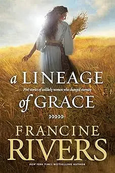 A woman in a light blue linen a lineage of grace dress walks through a golden wheat field holding stalks