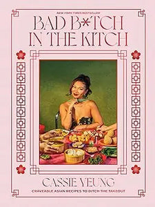 The book bad b*tch in the kitch by cassie yeung features a pink cover with a woman at a food-filled table