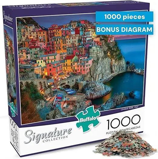Buffalo Games 1418 signature series 1000-piece puzzle of a vibrant colorful coastal village with illuminated buildings and boats