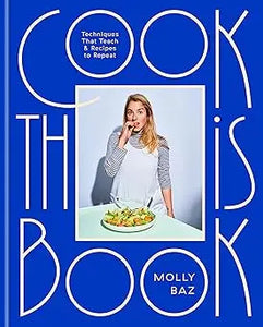 Blue cookbook cook this book by molly baz showing a woman in an apron beside a plate of food on the cover
