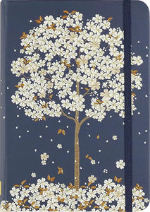 A navy blue falling blossoms journal with a delicate white flower and gold leaf illustration and matching elastic band