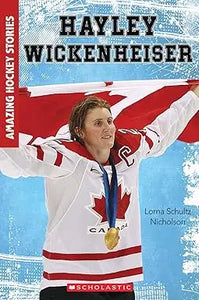 A young woman wearing a white and red canadian hockey jersey and gold medal holding a canadian flag is hayley wickenheiser