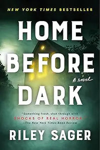 The book cover of Home Before Dark features bold white title text with a dark green and yellow house at night background