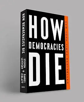 Black hardcover book how democracies die with bold white title and orange spine published by penguin