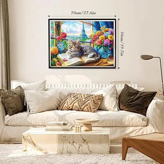 A 1000 piece jigsaw puzzle featuring a fluffy tabby kitten with yellow eyes on a book near flowers and the eiffel tower view