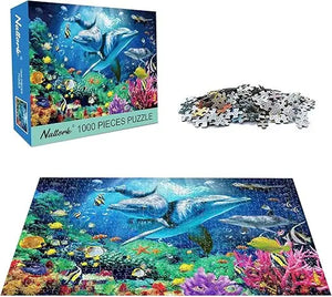A vibrant sea world 1000-piece jigsaw puzzle featuring dolphins and colorful coral reefs in a blue natterb box