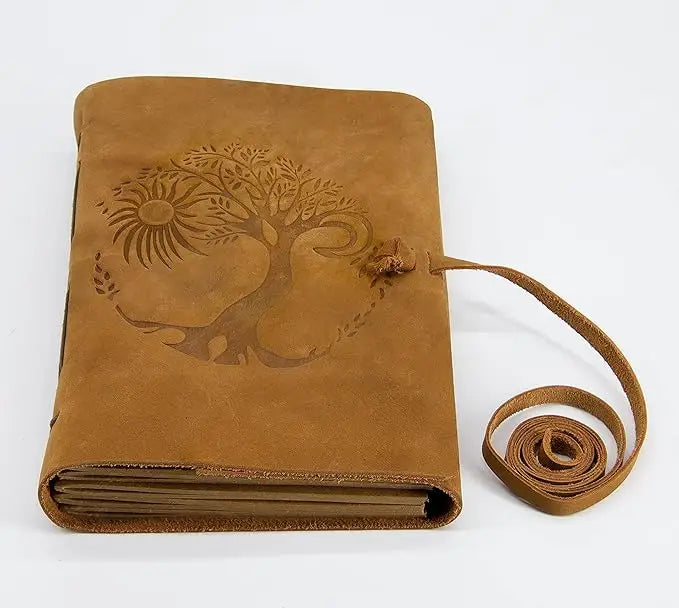 Tan suede leather journal for women and men with embossed tree of life sun design and leather tie closure