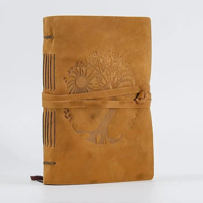 Tan suede leather journal for women and men with embossed tree of life sun design and leather tie closure