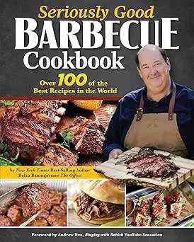 The seriously good barbecue cookbook cover shows a smiling man in a brown apron holding grilled ribs on a wooden board