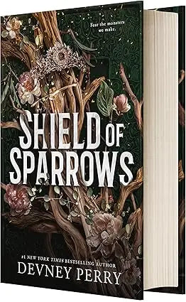 The book Shield of Sparrows by Devney Perry features a dark green cover with intricate floral and branch illustrations