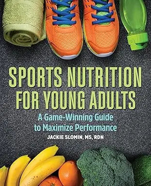 Bright orange athletic shoes with blue laces and white soles next to a green towel in sports nutrition for young adults