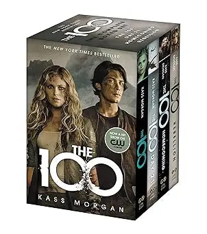 The 100 complete boxed set by kass morgan features a dark gray cover with bold white and silver lettering