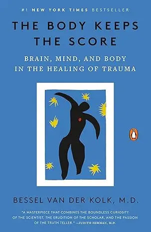 Blue hardcover book the body keeps the score by bessel van der kolk m.d about healing trauma through brain mind and body