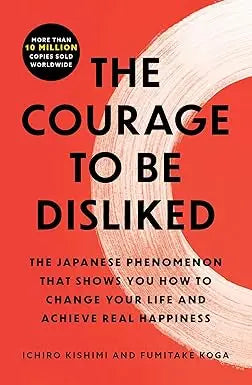 The courage to be disliked book cover with bold black text on vibrant red background and white brushstroke design