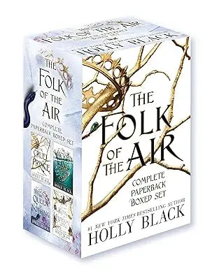 The folk of the air complete paperback boxed set with intricate gold and white illustrations on soft blue cover