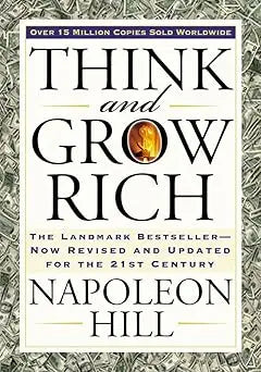 The book cover of Think and Grow Rich features bold black lettering and a gold emblem by Napoleon Hill